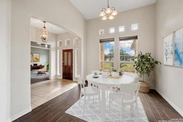 14019 Tahoe Vis, San Antonio, TX 78253 - dining area featuring arched walkways, an inviting chandelier, and wood finished floors