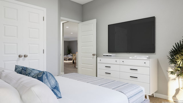 bedroom featuring baseboards and light carpet