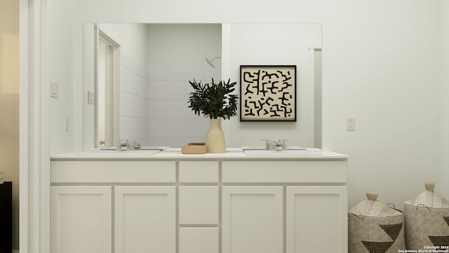 bathroom featuring double vanity and a sink