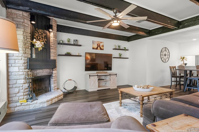 217 T Bar M # B21, New Braunfels, TX 78132 - living room with beamed ceiling, a fireplace, baseboards, and wood finished floors