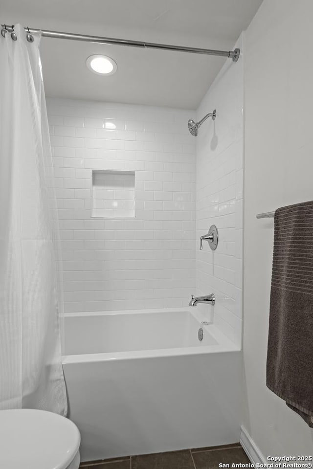 217 T Bar M # B21, New Braunfels, TX 78132 - full bath featuring tile patterned flooring, toilet, and shower / bathtub combination with curtain