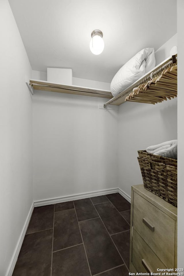 217 T Bar M # B21, New Braunfels, TX 78132 - spacious closet featuring dark tile patterned flooring