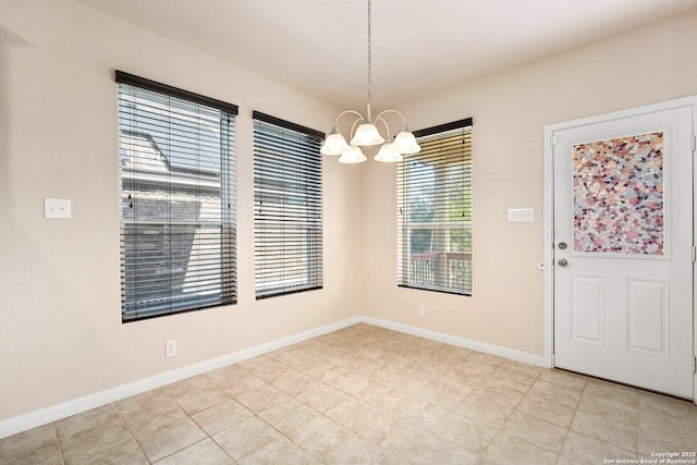 12604 Brite Rnch, San Antonio, TX 78245 - unfurnished dining area with baseboards and an inviting chandelier