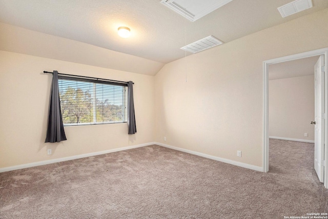 12604 Brite Rnch, San Antonio, TX 78245 - carpeted empty room featuring visible vents, baseboards, and vaulted ceiling