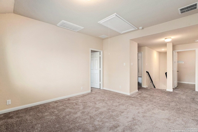 12604 Brite Rnch, San Antonio, TX 78245 - spare room with attic access, visible vents, and carpet floors