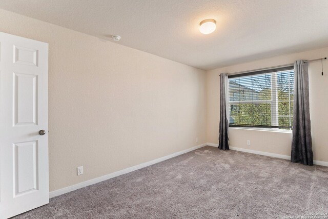 12604 Brite Rnch, San Antonio, TX 78245 - spare room featuring baseboards and carpet flooring