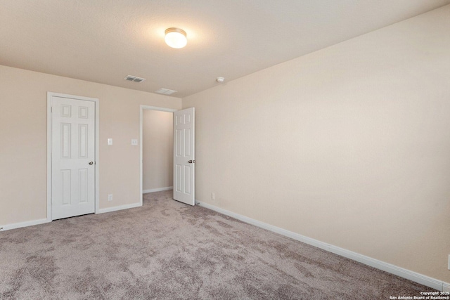 12604 Brite Rnch, San Antonio, TX 78245 - unfurnished bedroom featuring visible vents, baseboards, and carpet