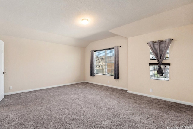 12604 Brite Rnch, San Antonio, TX 78245 - spare room featuring carpet floors, baseboards, and vaulted ceiling