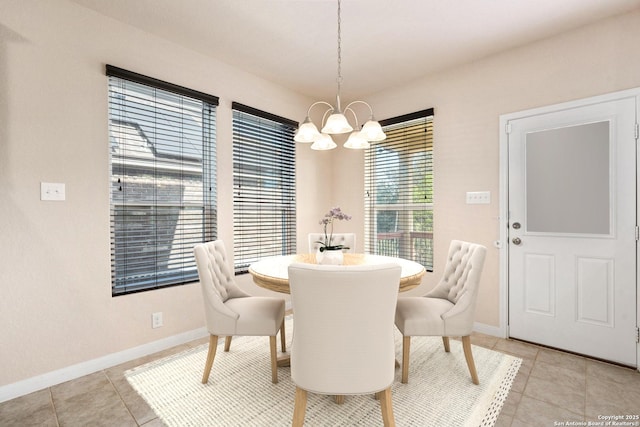 12604 Brite Rnch, San Antonio, TX 78245 - dining room with a chandelier, baseboards, and light tile patterned flooring