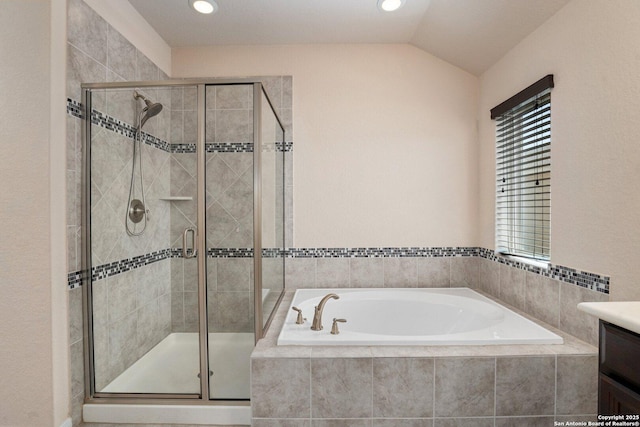 12604 Brite Rnch, San Antonio, TX 78245 - full bath with a stall shower, vanity, lofted ceiling, and a garden tub