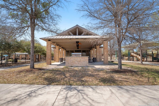 12604 Brite Rnch, San Antonio, TX 78245 - view of front of home featuring fence, playground community, area for grilling, ceiling fan, and a patio area