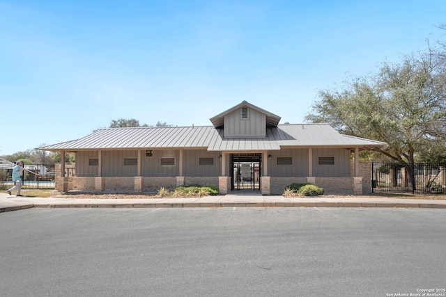 12604 Brite Rnch, San Antonio, TX 78245 - view of front facade with a gate, fence, and board and batten siding