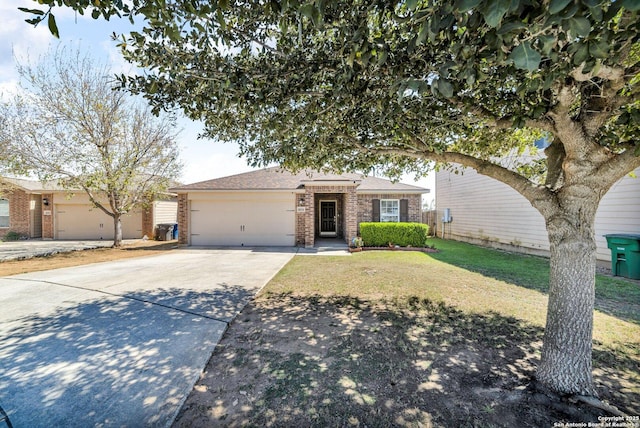 ranch-style house featuring brick siding, driveway, an attached garage, and a front yard