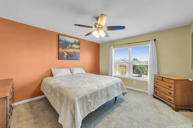 bedroom with baseboards, light carpet, and ceiling fan