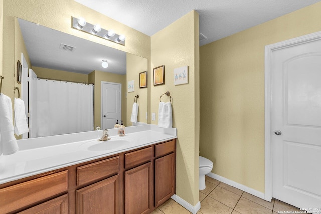 full bath featuring visible vents, baseboards, toilet, tile patterned floors, and vanity