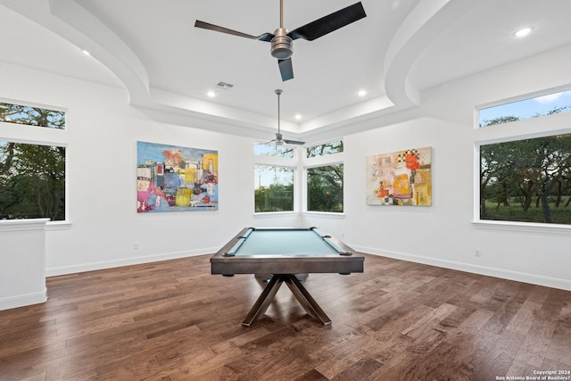 rec room featuring a healthy amount of sunlight, baseboards, a tray ceiling, and wood finished floors