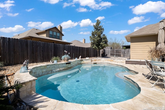 view of pool featuring a fenced in pool, a fenced backyard, and a patio area