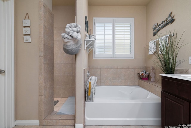 full bathroom with tiled shower, a garden tub, and vanity