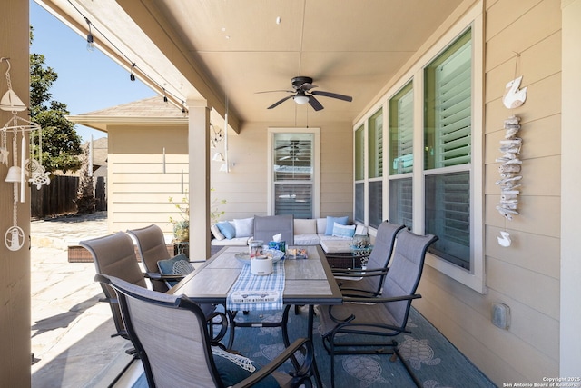 view of patio / terrace with outdoor dining space, an outdoor living space, a ceiling fan, and fence