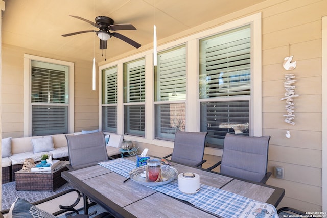 view of patio with outdoor dining space, outdoor lounge area, and a ceiling fan