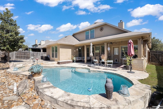 view of swimming pool featuring ceiling fan, a fenced in pool, a patio, and a fenced backyard