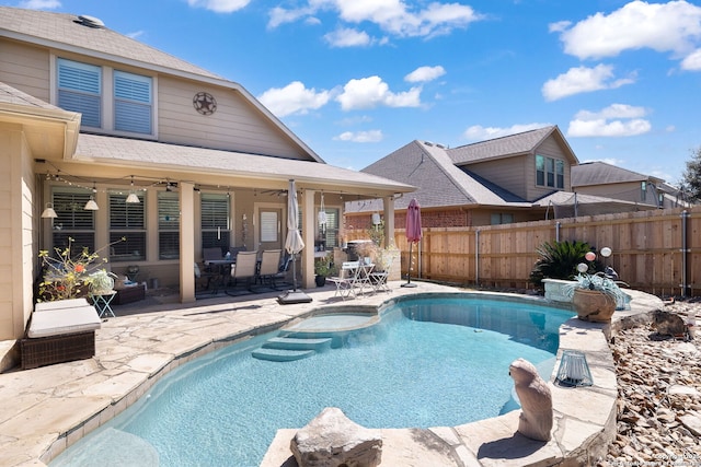 view of swimming pool featuring a patio area, a fenced in pool, a ceiling fan, and fence