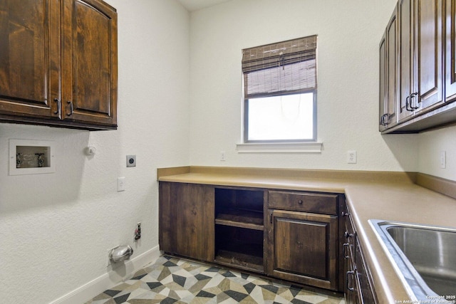 washroom featuring hookup for a gas dryer, cabinet space, hookup for an electric dryer, light floors, and hookup for a washing machine