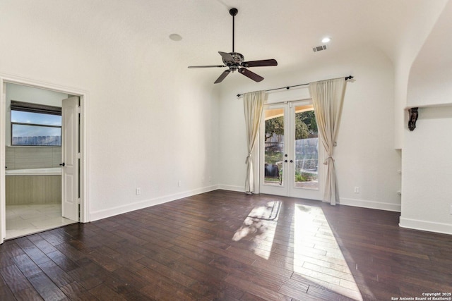 spare room featuring visible vents, baseboards, hardwood / wood-style floors, french doors, and a ceiling fan