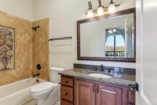 bathroom with shower / washtub combination, toilet, and vanity