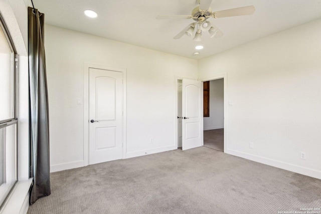 unfurnished bedroom featuring carpet flooring, recessed lighting, and baseboards