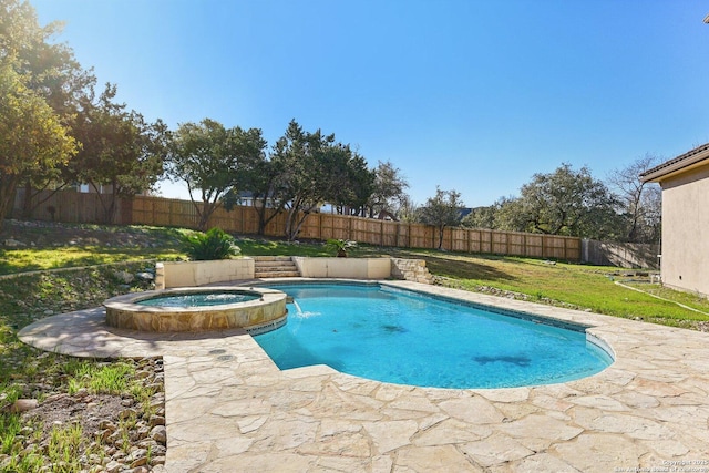 view of swimming pool with a lawn, a pool with connected hot tub, and a fenced backyard