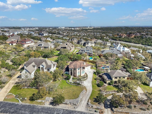 birds eye view of property with a residential view