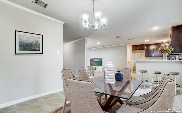 dining area featuring visible vents, crown molding, baseboards, recessed lighting, and a notable chandelier