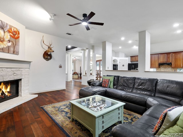 living area featuring visible vents, hardwood / wood-style floors, recessed lighting, a fireplace, and ceiling fan