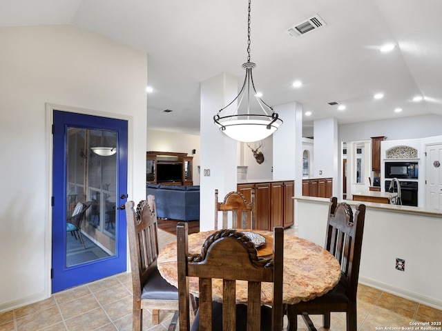 dining area with lofted ceiling, light tile patterned floors, recessed lighting, and visible vents