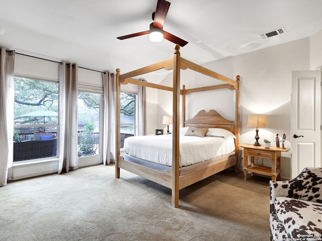 bedroom with visible vents, ceiling fan, and carpet