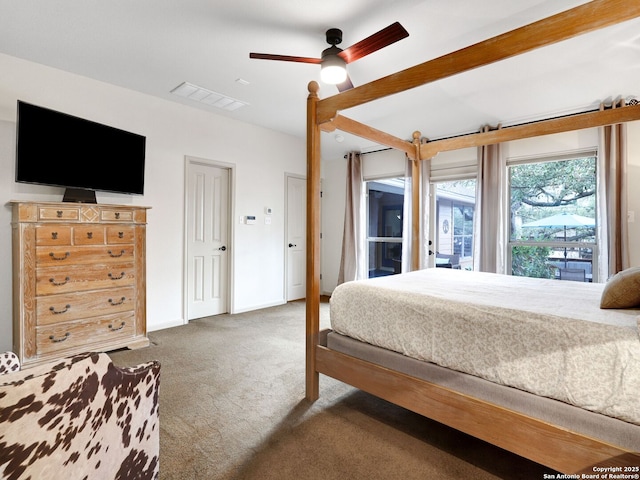 carpeted bedroom featuring visible vents, baseboards, and ceiling fan