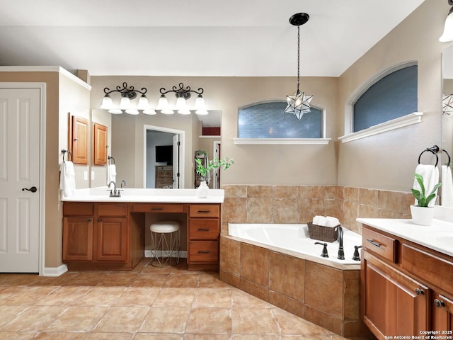 full bathroom with a sink, a garden tub, two vanities, and tile patterned floors