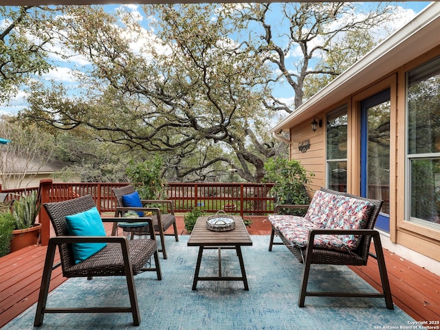 wooden deck featuring an outdoor hangout area