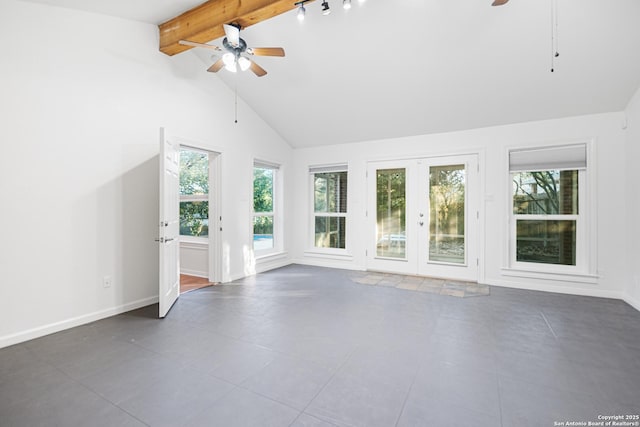 unfurnished living room with a wealth of natural light, french doors, and a ceiling fan