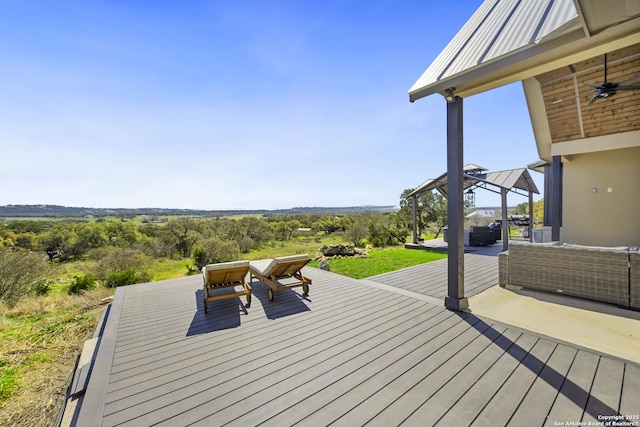 deck with a gazebo, outdoor lounge area, and a ceiling fan