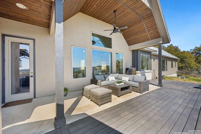 wooden terrace featuring outdoor lounge area and ceiling fan