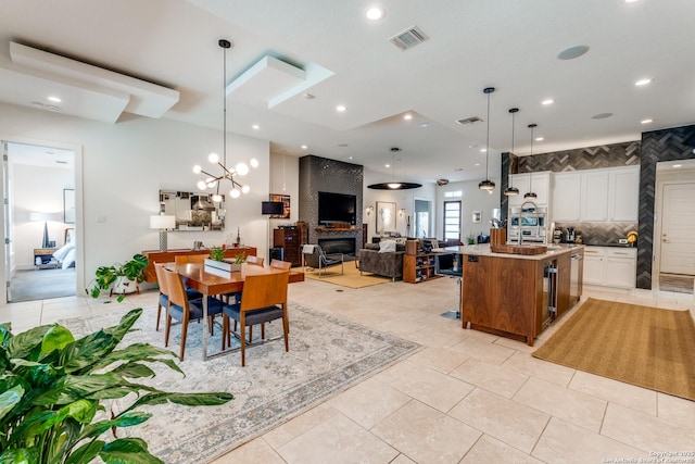 dining space featuring light tile patterned floors, recessed lighting, and visible vents