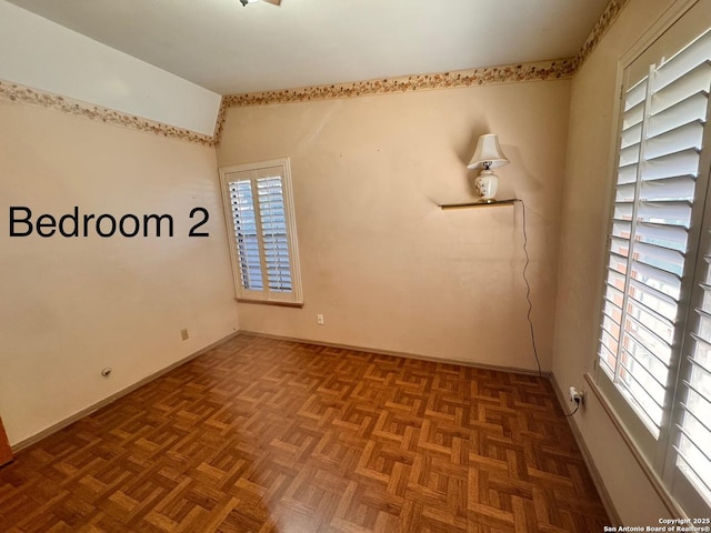 empty room with vaulted ceiling