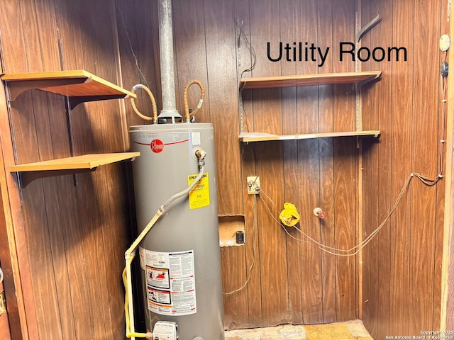 utility room with water heater