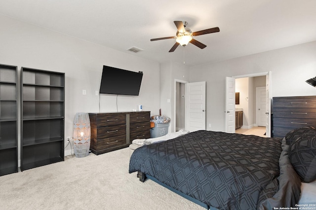 carpeted bedroom featuring visible vents and a ceiling fan