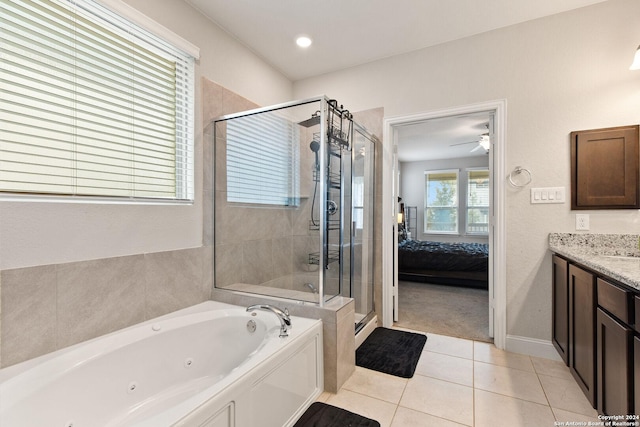 full bath featuring vanity, a tub with jets, a shower stall, ensuite bathroom, and tile patterned floors