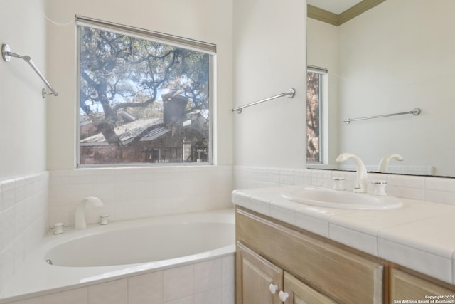 full bathroom with a garden tub and vanity