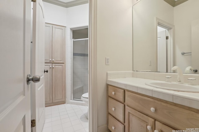 bathroom with vanity, a shower stall, crown molding, toilet, and tile patterned floors