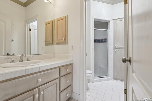 full bath featuring vanity, a shower stall, toilet, and tile patterned floors